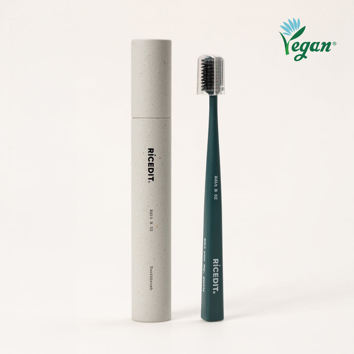 RICEDIT Edit 02 toothbrush with green handle, protective cap, and matching paper tube packaging